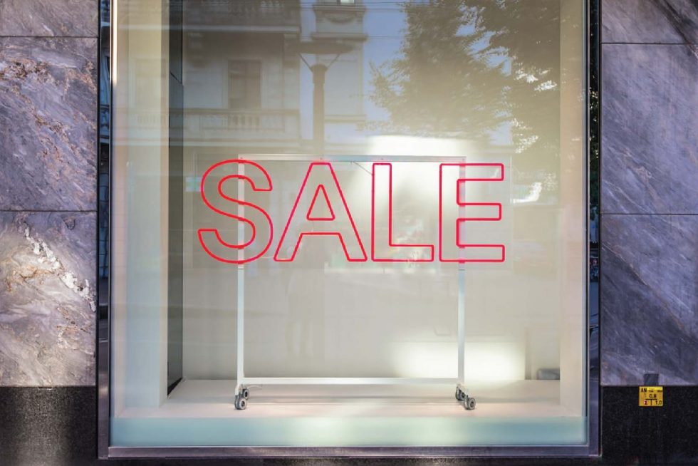 window pane with word 'SALE'
