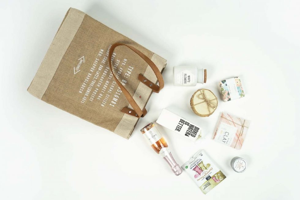 Cosmetic and shopping bag on the table