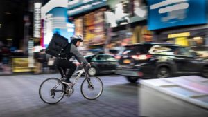 person riding fast on a bicycle
