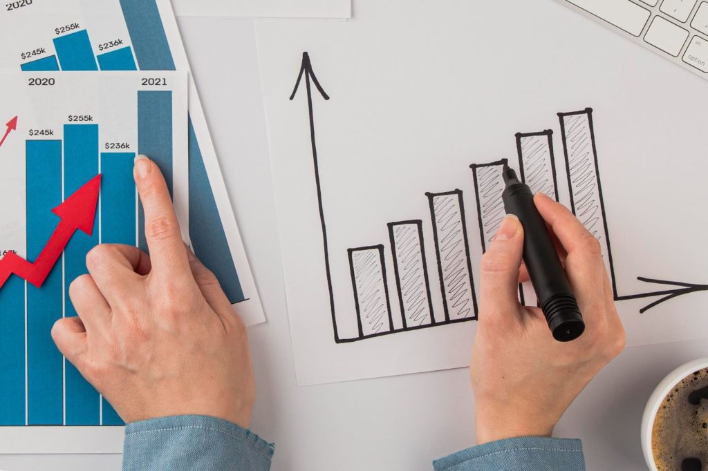 person showing the business graph growing
