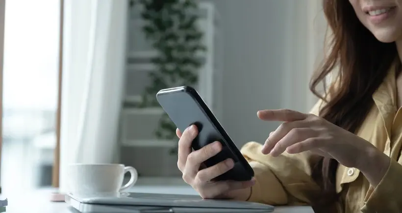 woman holding smart phone