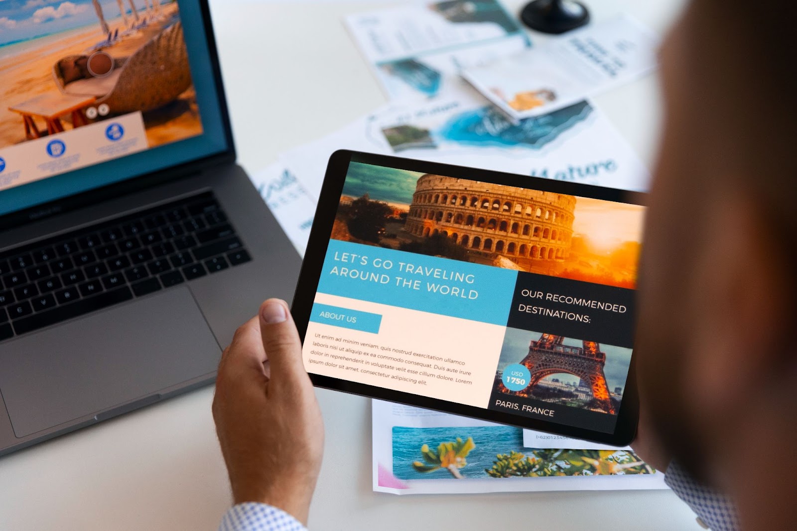 A person holding a tablet displaying a travel website titled 'Let's Go Traveling Around the World' with photos of the Colosseum and Eiffel Tower